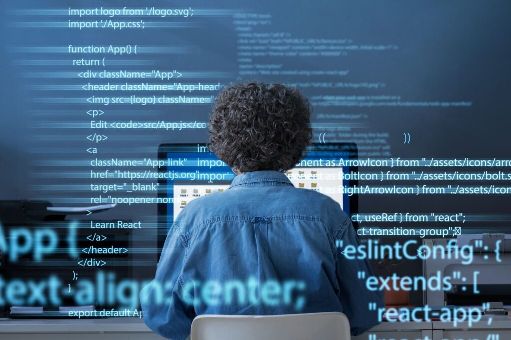 Programming background with person working with codes on computer